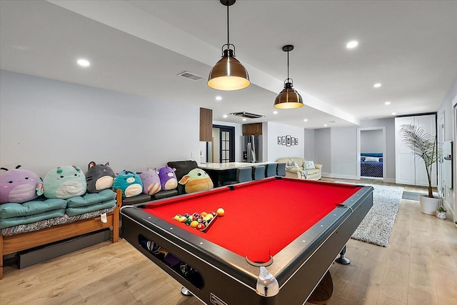 game room with light wood-type flooring, visible vents, and recessed lighting