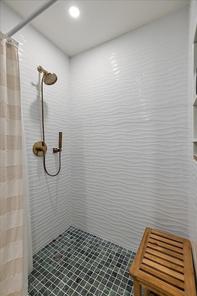 bathroom featuring a shower stall