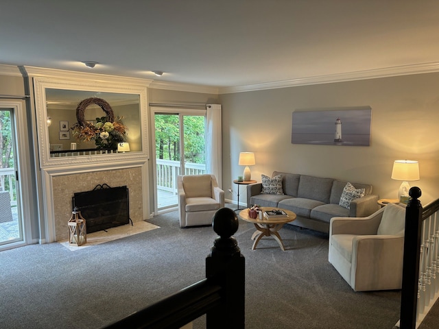 living room with a tiled fireplace, ornamental molding, and carpet floors