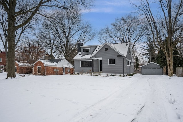 view of front facade with a garage and an outdoor structure