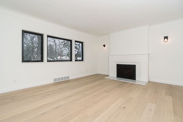 unfurnished living room featuring light hardwood / wood-style floors