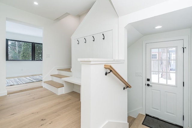 mudroom with light hardwood / wood-style floors