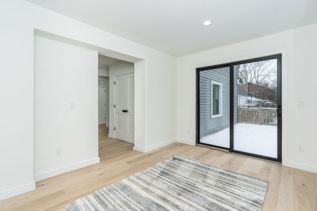 unfurnished room featuring light wood-type flooring