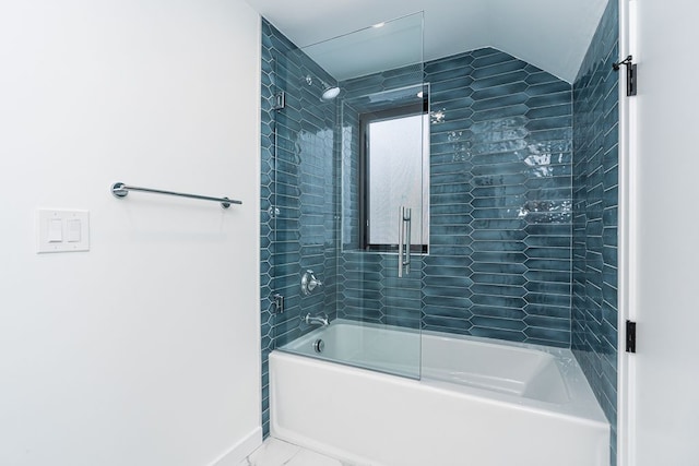 bathroom with enclosed tub / shower combo and lofted ceiling