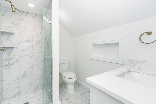 bathroom featuring vanity, toilet, walk in shower, and lofted ceiling