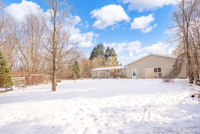 view of yard covered in snow