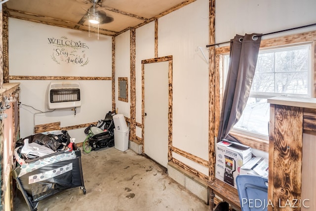 interior space with electric panel and heating unit