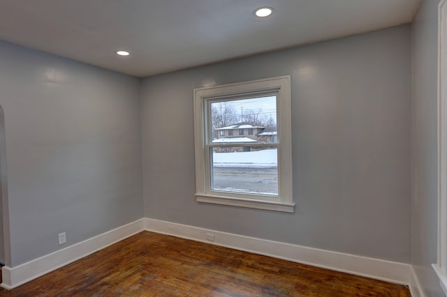 unfurnished room featuring dark hardwood / wood-style flooring