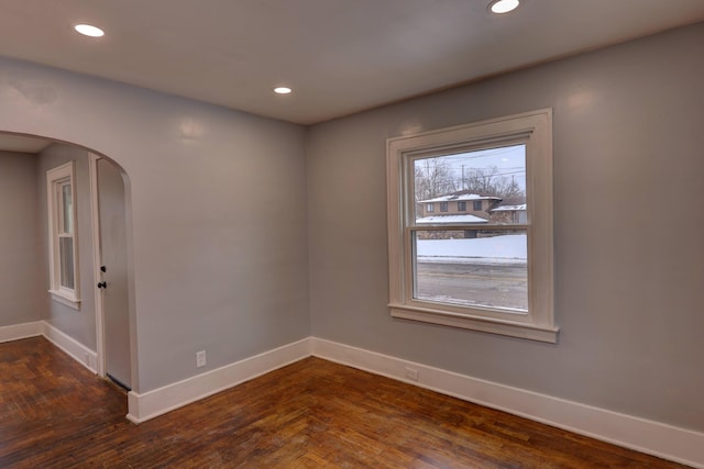 unfurnished room with dark hardwood / wood-style floors