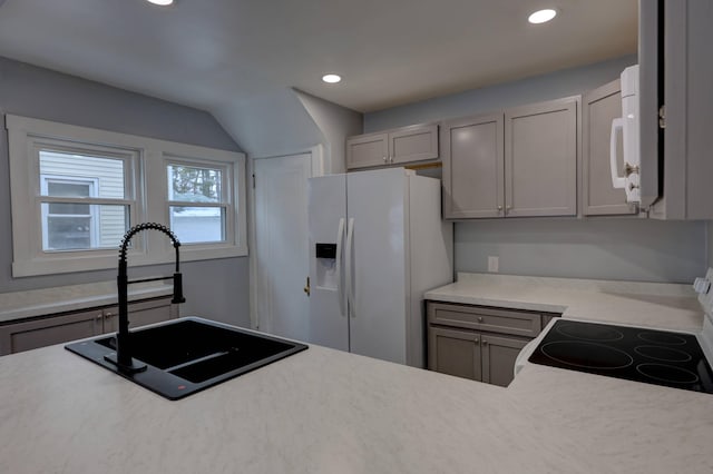 kitchen with sink, white appliances, and gray cabinets