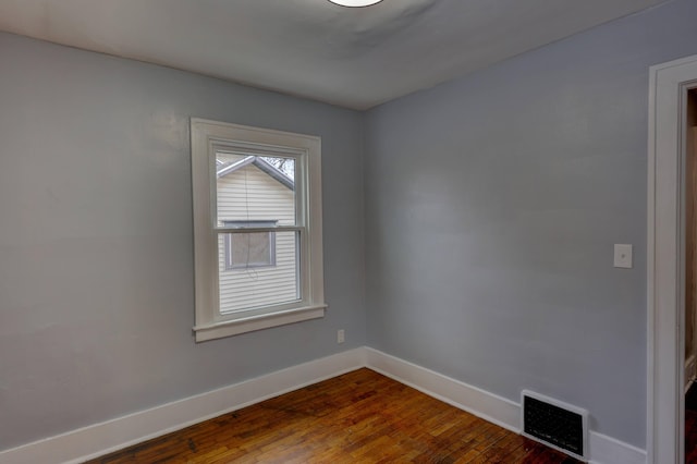 empty room featuring hardwood / wood-style floors