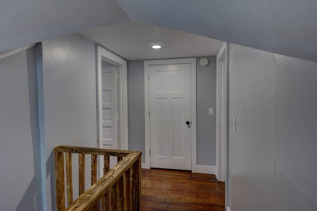 corridor with dark hardwood / wood-style floors