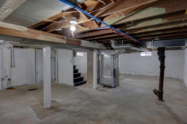 basement featuring heating unit