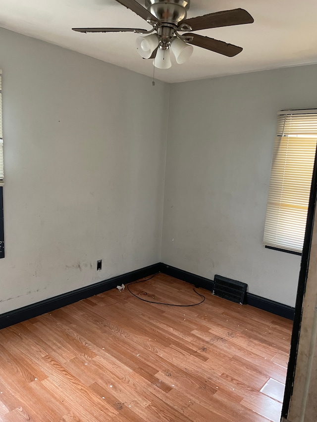 unfurnished room featuring ceiling fan and light hardwood / wood-style flooring