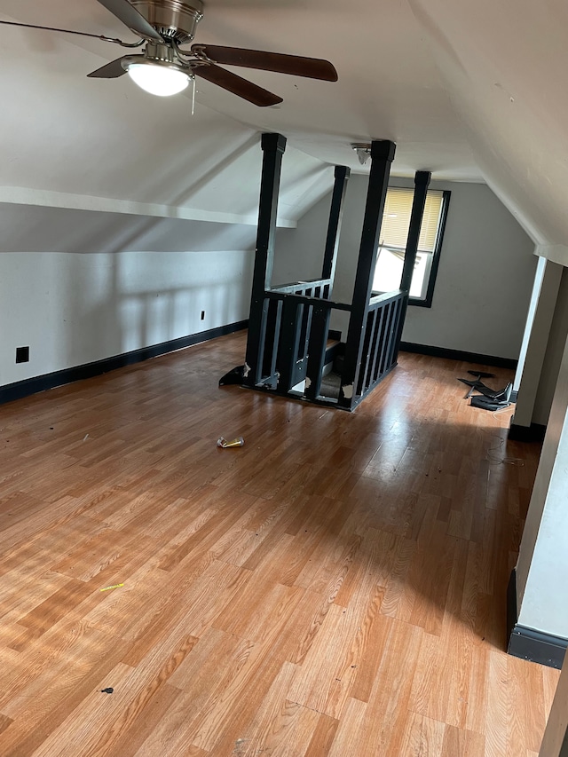 bonus room with lofted ceiling and light hardwood / wood-style flooring