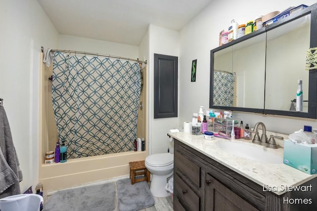 full bathroom featuring toilet, vanity, and shower / bath combination with curtain