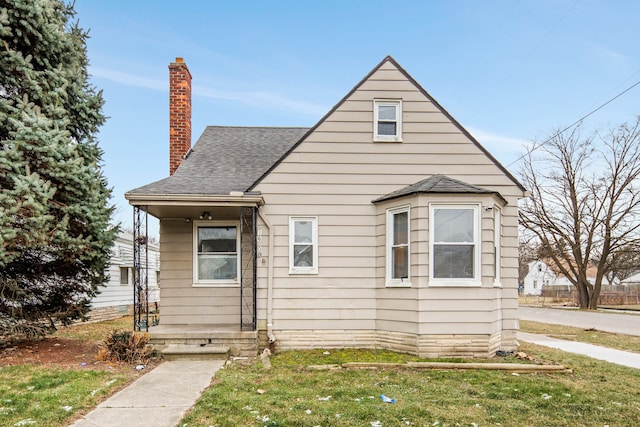 bungalow with a front lawn