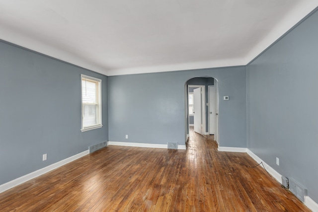 spare room featuring dark hardwood / wood-style floors