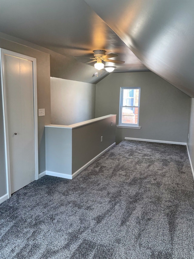 bonus room with ceiling fan, lofted ceiling, and carpet flooring