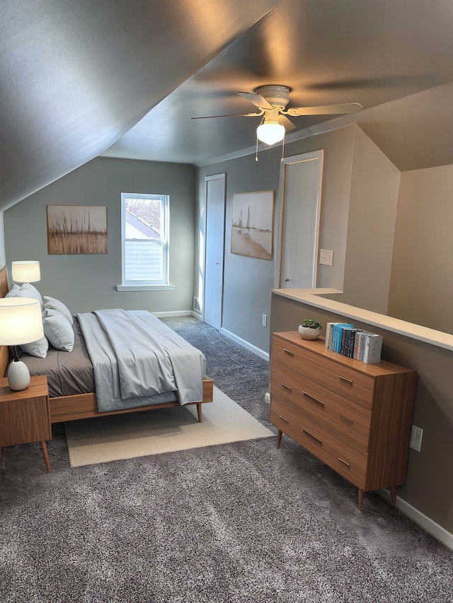 carpeted bedroom with ceiling fan and lofted ceiling