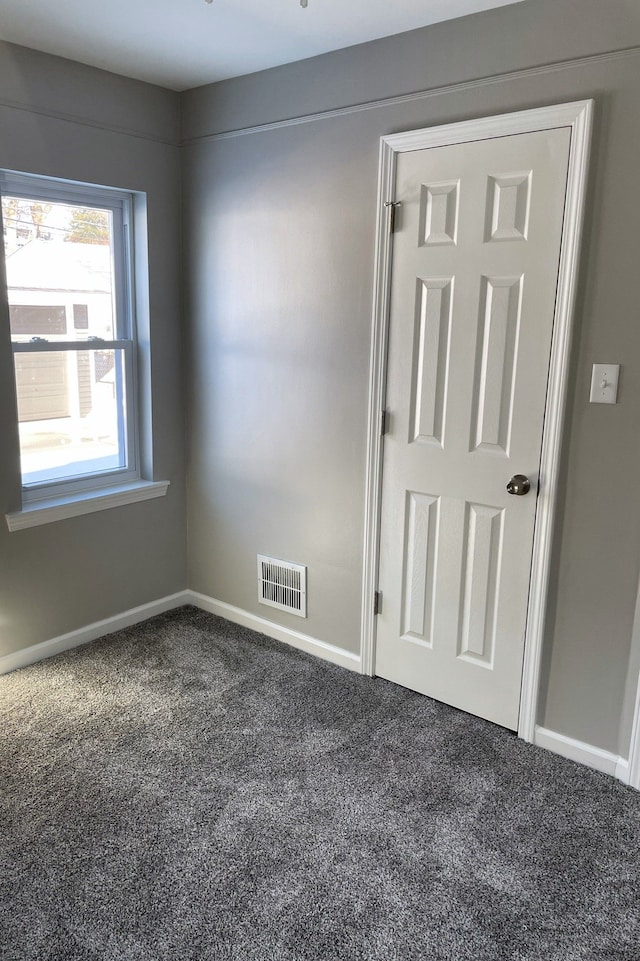 unfurnished room with carpet