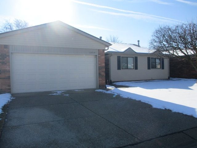 single story home with a garage