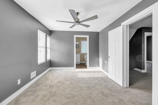 spare room with ceiling fan and carpet flooring