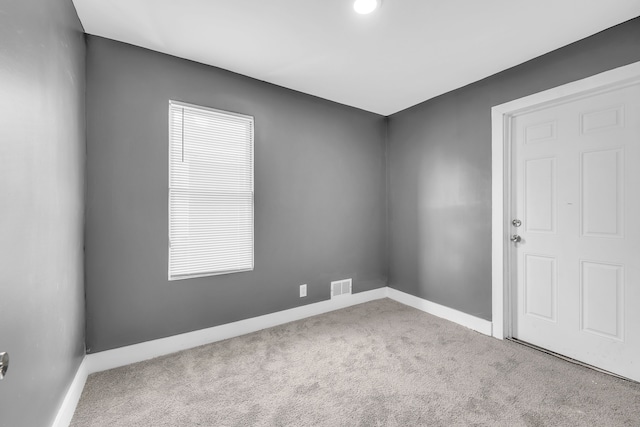 unfurnished room with carpet flooring