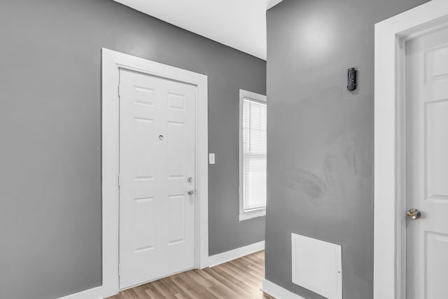 foyer with a wealth of natural light and light hardwood / wood-style floors