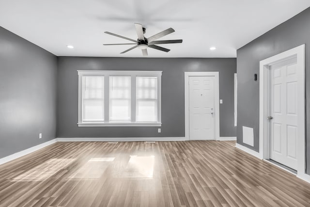 unfurnished room with ceiling fan and light hardwood / wood-style flooring