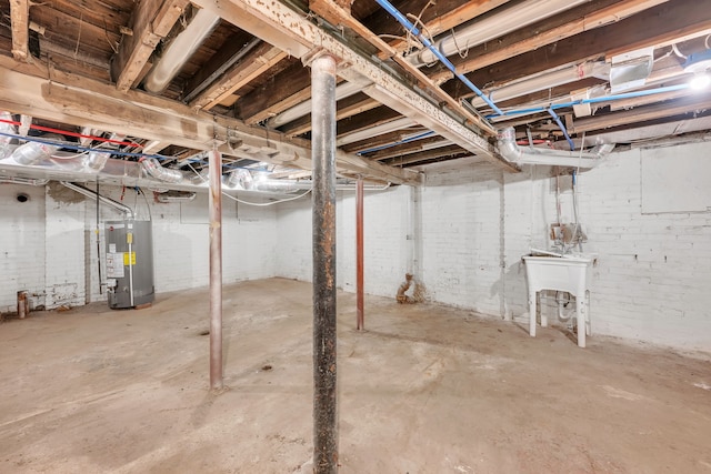 basement with brick wall and gas water heater