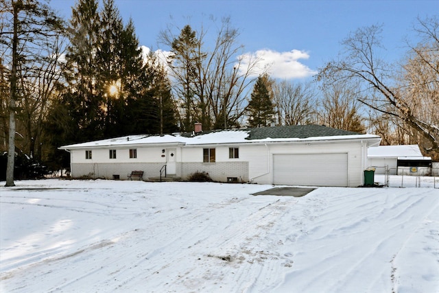 ranch-style home featuring a garage