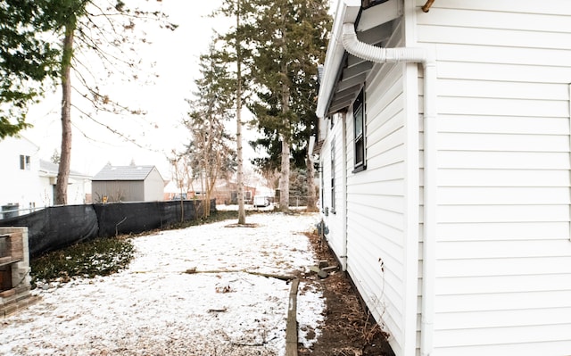 view of yard covered in snow