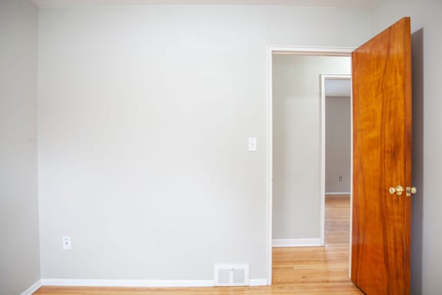 unfurnished room featuring light hardwood / wood-style floors