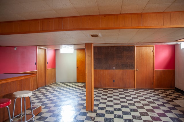 basement with wood walls