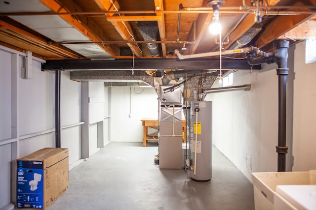 basement featuring water heater and heating unit