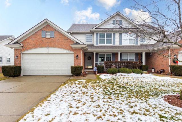 view of front of property featuring a garage and a porch