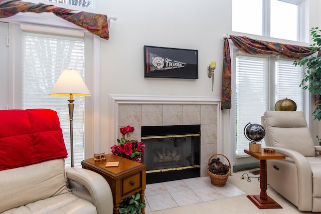 living room with a tiled fireplace