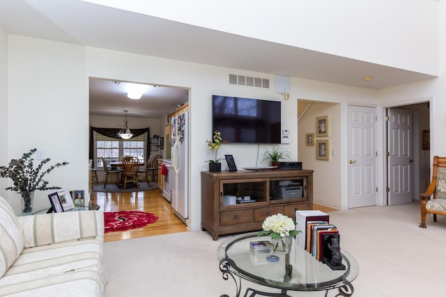 living room featuring light colored carpet