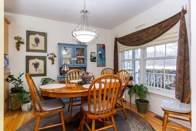 dining room with hardwood / wood-style floors