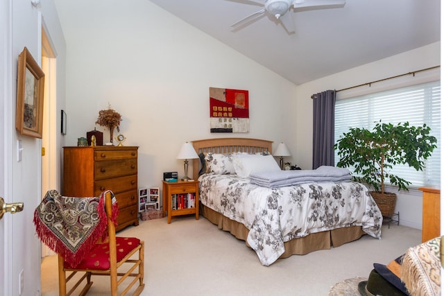 bedroom with ceiling fan, carpet, and vaulted ceiling