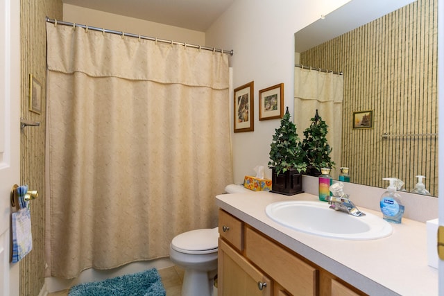 bathroom with toilet, vanity, tile patterned flooring, and a shower with curtain