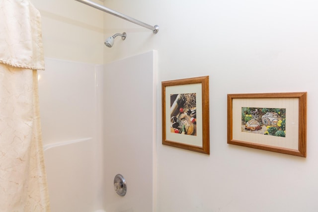 bathroom with shower / bath combination with curtain