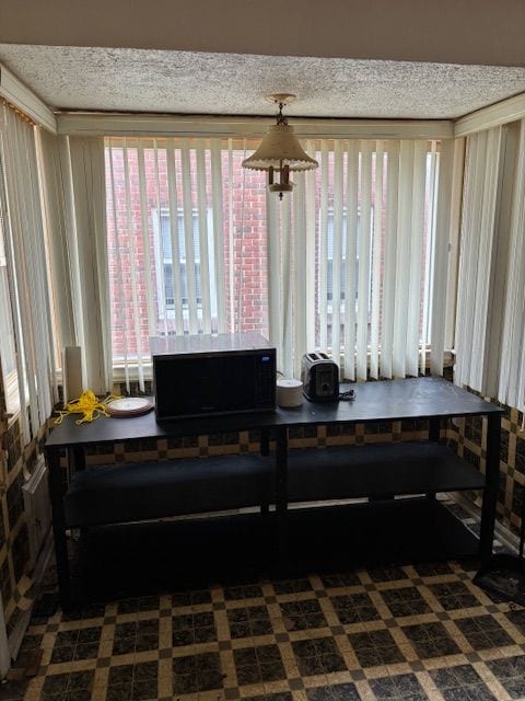 office space featuring a textured ceiling