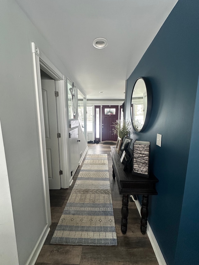 corridor with dark wood-type flooring