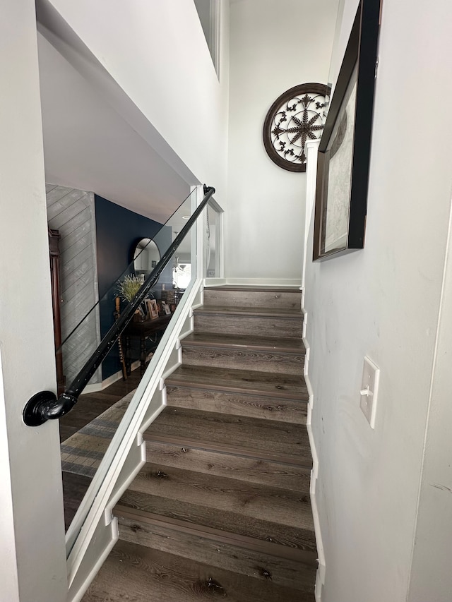 stairs with wood finished floors