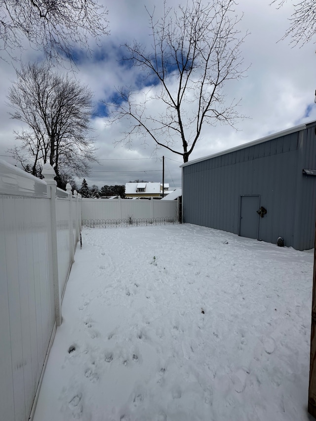 view of yard layered in snow