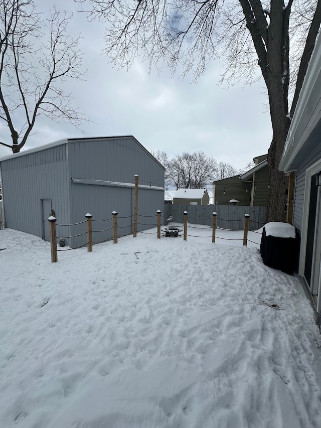 view of yard layered in snow