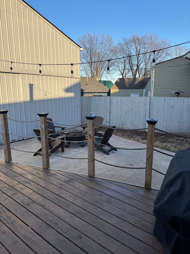 deck with fence and area for grilling