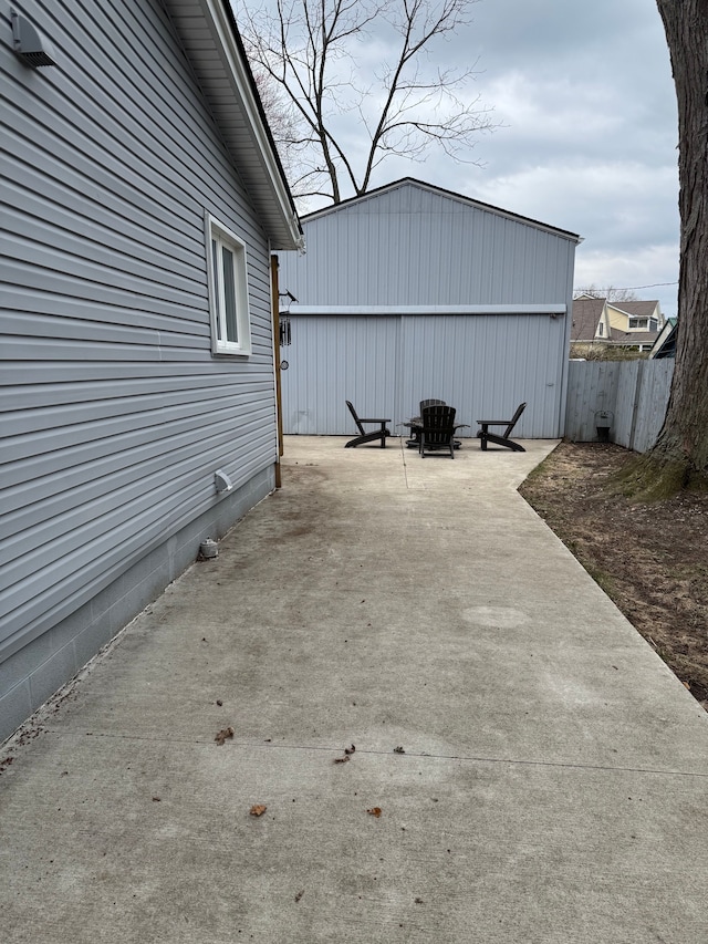 view of patio / terrace featuring fence